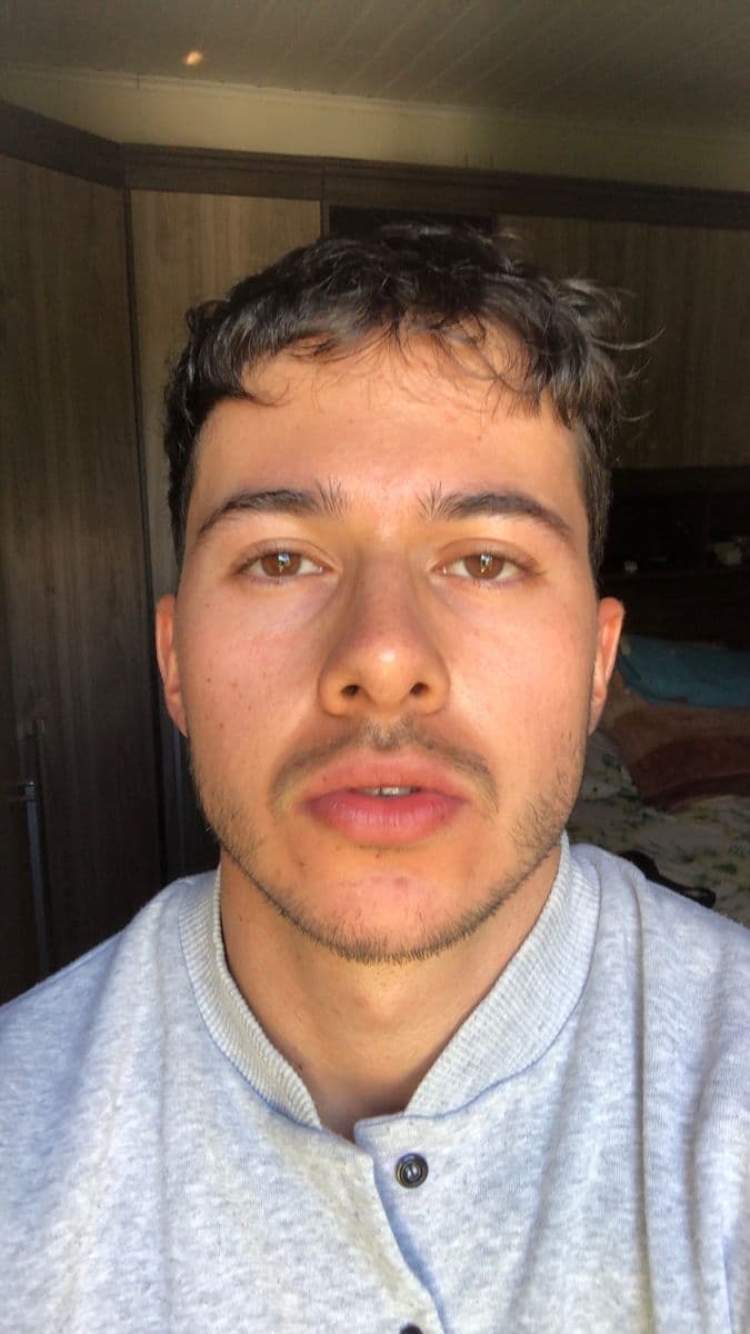Original casual selfie before compliant passport photo conversion